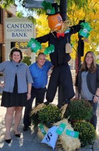 Canton Co-operative employees with scarecrow